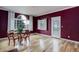 Bright dining room with hardwood floors, a decorative window, and a glass-topped table at 31 N Algonquian St, Aurora, CO 80018