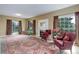 Spacious living room with large windows, a fireplace, and comfortable seating at 31 N Algonquian St, Aurora, CO 80018