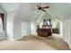 Spacious primary bedroom with vaulted ceilings, carpet floors, a ceiling fan, and natural light at 31 N Algonquian St, Aurora, CO 80018