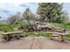 Backyard pond with two benches and lush greenery at 31 N Algonquian St, Aurora, CO 80018