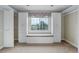 Walk-in closet with built-in shelving, drawers, window seat, and natural lighting at 31 N Algonquian St, Aurora, CO 80018