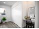 Well-lit bedroom features closet, window, and vanity with modern black chair at 2123 N Coronado Pkwy # C, Denver, CO 80229