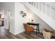 Hallway with a cozy desk area and modern staircase at 2123 N Coronado Pkwy # C, Denver, CO 80229