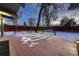 Backyard deck with snow on the ground and landscape lighting at 6127 S Westview St, Littleton, CO 80120