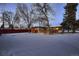 View of home from the backyard with snow on the ground at 6127 S Westview St, Littleton, CO 80120