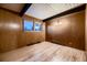 Spacious bedroom with wood floors and wood paneled walls at 6127 S Westview St, Littleton, CO 80120