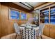 Dining area with round table and mid century modern chairs at 6127 S Westview St, Littleton, CO 80120