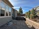 Cozy backyard featuring a hot tub, patio, and retaining wall for a tranquil outdoor experience at 10137 Atlanta St, Parker, CO 80134