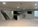 Spacious basement with a bar, built-in shelving, and cozy carpeting, perfect for entertainment at 10137 Atlanta St, Parker, CO 80134