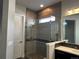 Sleek bathroom with a glass-enclosed shower and modern tile accents at 10137 Atlanta St, Parker, CO 80134