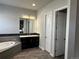 Elegant bathroom featuring a soaking tub, sleek vanity, and modern fixtures at 10137 Atlanta St, Parker, CO 80134