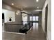 Bright, open hallway featuring modern lighting, wood floors, and wrought iron stair railing at 10137 Atlanta St, Parker, CO 80134