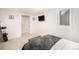 Basement bedroom with a queen bed and window at 5217 E Martin Luther King Jr Blvd, Denver, CO 80207