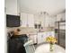 Modern kitchen with white cabinets and stainless steel appliances at 5217 E Martin Luther King Jr Blvd, Denver, CO 80207