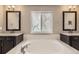 Beautiful bathroom featuring a tub and separate double vanities at 20830 Scenic Park Dr, Parker, CO 80138