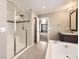 Bathroom featuring a standalone shower, soaking tub and granite countertops at 20830 Scenic Park Dr, Parker, CO 80138