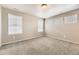 Bright bedroom with neutral walls and multiple windows offering ample natural light at 20830 Scenic Park Dr, Parker, CO 80138