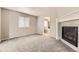 Bedroom featuring neutral walls, carpet and a cozy fireplace at 20830 Scenic Park Dr, Parker, CO 80138