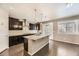 Stylish kitchen with dark cabinetry, granite countertops, stainless steel appliances, and a large island at 20830 Scenic Park Dr, Parker, CO 80138