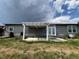 The backyard features a small pergola attached to the house at 6100 Bluestem # 238, Frederick, CO 80530