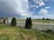 The backyard features a picket fence that overlooks a field at 6100 Bluestem # 238, Frederick, CO 80530