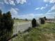 Backyard view overlooking a field with a white picket fence at 6100 Bluestem # 238, Frederick, CO 80530