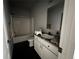 Bathroom featuring a shower and tub, vanity, and a large mirror at 6100 Bluestem # 238, Frederick, CO 80530