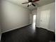 This bedroom features a ceiling fan and dark, hardwood floors at 6100 Bluestem # 238, Frederick, CO 80530