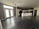 Spacious open concept floor plan with dark wood floors and a large kitchen area at 6100 Bluestem # 238, Frederick, CO 80530