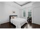 Comfortable bedroom with large windows and city views at 1940 Blake St # 300, Denver, CO 80202