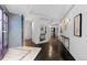 Long hallway featuring modern decor and a mirror, creating depth and visual interest at 1940 Blake St # 300, Denver, CO 80202