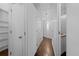 Hallway with multiple doors, storage space, and modern lighting fixtures at 1940 Blake St # 300, Denver, CO 80202