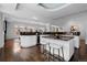 Spacious kitchen with granite countertops, modern appliances, a breakfast bar and sleek, white cabinetry at 1940 Blake St # 300, Denver, CO 80202
