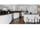 Bright kitchen featuring dark granite counters, white cabinets, and stainless-steel appliances at 1940 Blake St # 300, Denver, CO 80202