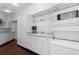 Clean laundry room featuring washer, dryer, and storage at 1940 Blake St # 300, Denver, CO 80202