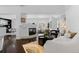 Bright living room featuring hardwood floors, a modern fireplace, and contemporary furnishings at 1940 Blake St # 300, Denver, CO 80202