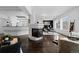 Open living area featuring a fireplace, modern decor, and hardwood floors at 1940 Blake St # 300, Denver, CO 80202