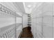 Walk-in pantry equipped with ample metal shelving and dark wood floors at 1940 Blake St # 300, Denver, CO 80202