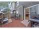Backyard patio with seating, barbecue grill, and sliding glass door access to the home at 14700 E 104Th Ave # 1602, Commerce City, CO 80022
