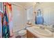 Bathroom featuring a single sink vanity, toilet, and shower with a colorful curtain at 14700 E 104Th Ave # 1602, Commerce City, CO 80022