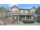 Charming townhome with a welcoming front porch, manicured landscaping, and a well-maintained exterior at 14700 E 104Th Ave # 1602, Commerce City, CO 80022
