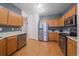 Efficient kitchen layout featuring stainless steel appliances and ample cabinet space at 14700 E 104Th Ave # 1602, Commerce City, CO 80022