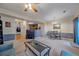 Open concept living room adjacent to the dining area and kitchen with great flow at 14700 E 104Th Ave # 1602, Commerce City, CO 80022
