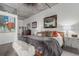 Comfortable bedroom featuring stylish decor, elegant lighting, and a cozy atmosphere at 2100 16Th St # 606, Denver, CO 80202