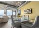 Contemporary dining room with glass table, comfortable seating, and city view at 2100 16Th St # 606, Denver, CO 80202