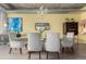 Modern dining room with seating for six, chandelier, and stylish decor at 2100 16Th St # 606, Denver, CO 80202