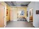 Modern entryway with exposed ductwork, a bench with colorful pillows, and unique decor at 2100 16Th St # 606, Denver, CO 80202