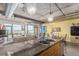 Open kitchen and living room with views of the city skyline from large windows at 2100 16Th St # 606, Denver, CO 80202