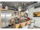Stylish kitchen with stainless steel appliances, granite countertops, and industrial-style lighting fixtures at 2100 16Th St # 606, Denver, CO 80202