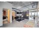 Open living area featuring concrete ceilings, modern furnishings, and a view of the dining area at 2100 16Th St # 606, Denver, CO 80202